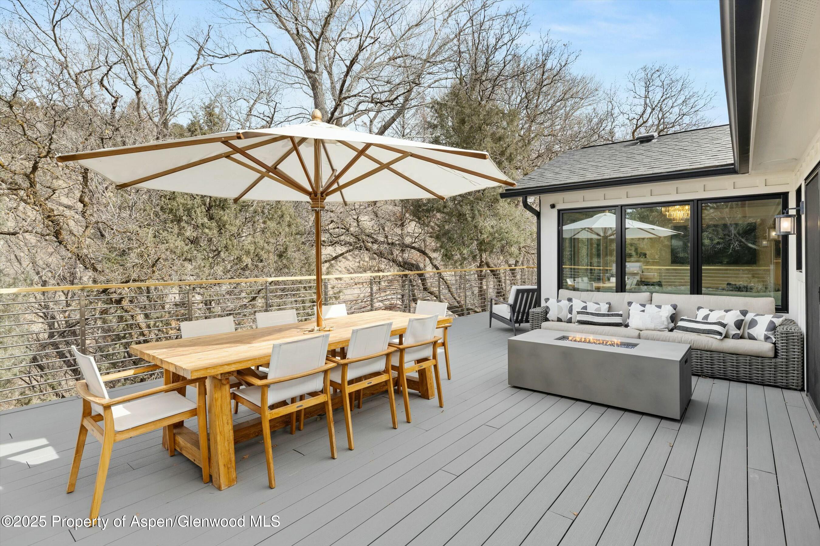1631 Emma Spur Basalt, CO 81621 - Photo 39 of 52 a view of a patio with a dining table and chairs