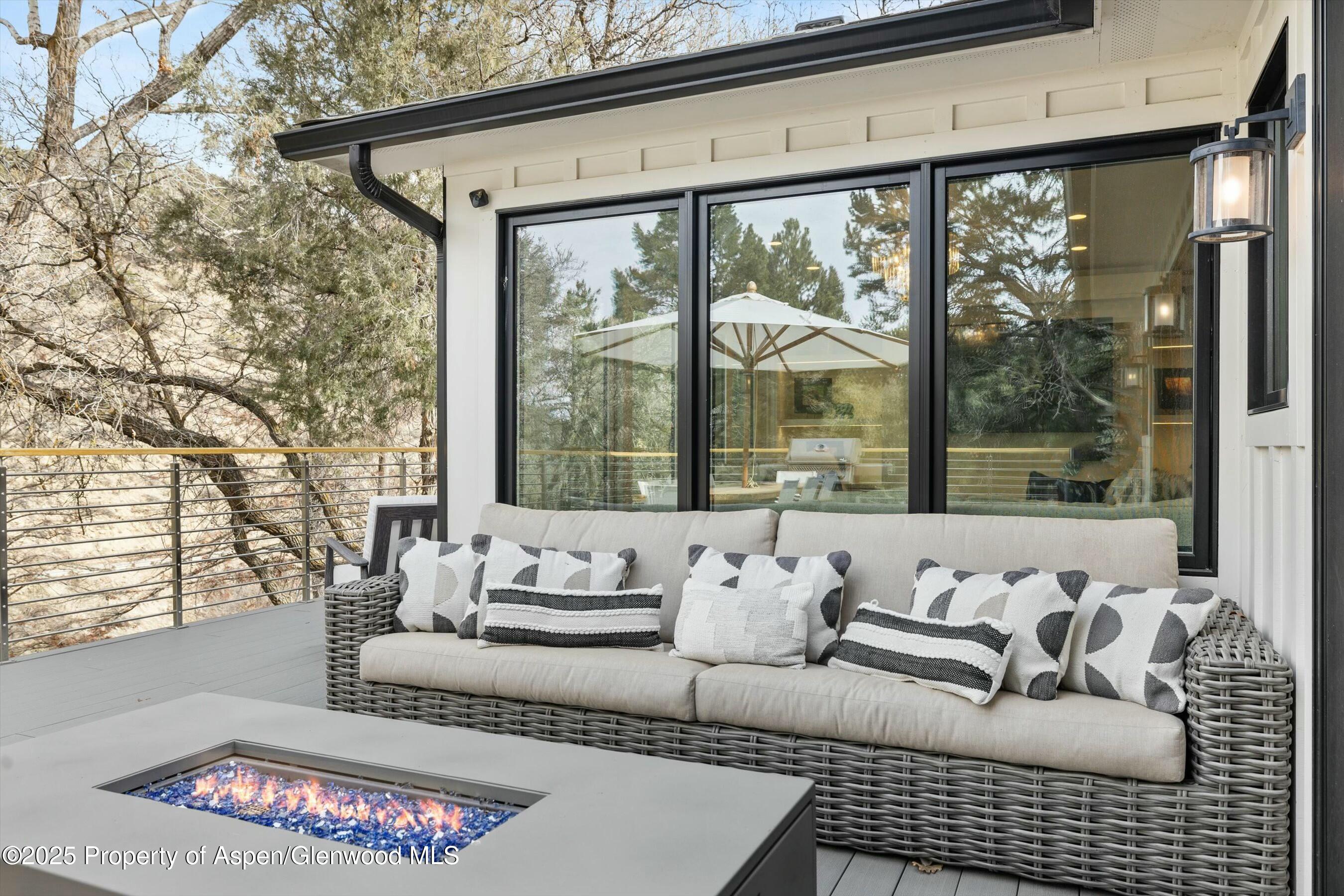 1631 Emma Spur Basalt, CO 81621 - Photo 42 of 52 a living room with furniture and a large window