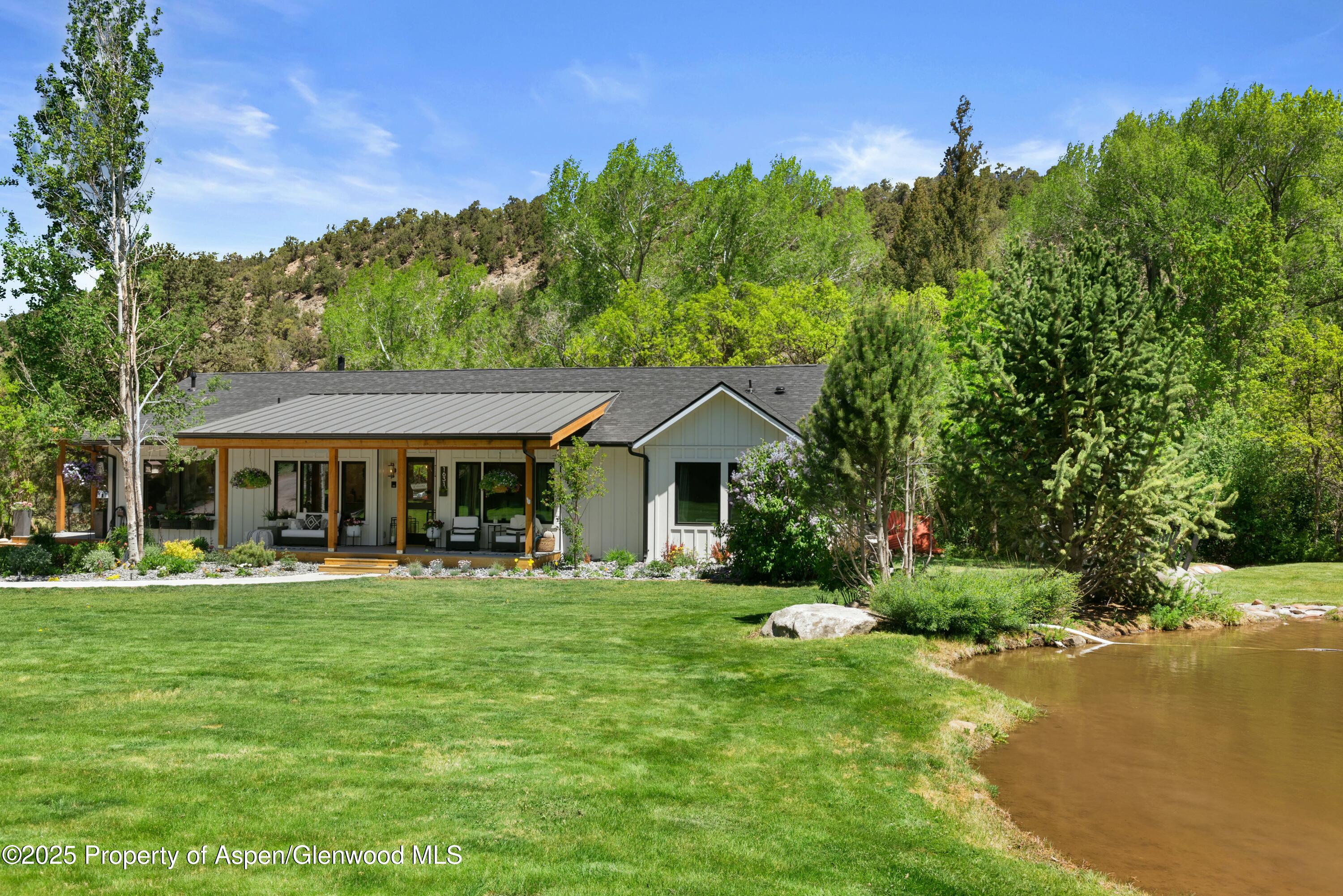 1631 Emma Spur Basalt, CO 81621 - Photo 45 of 52 a front view of a house with a yard