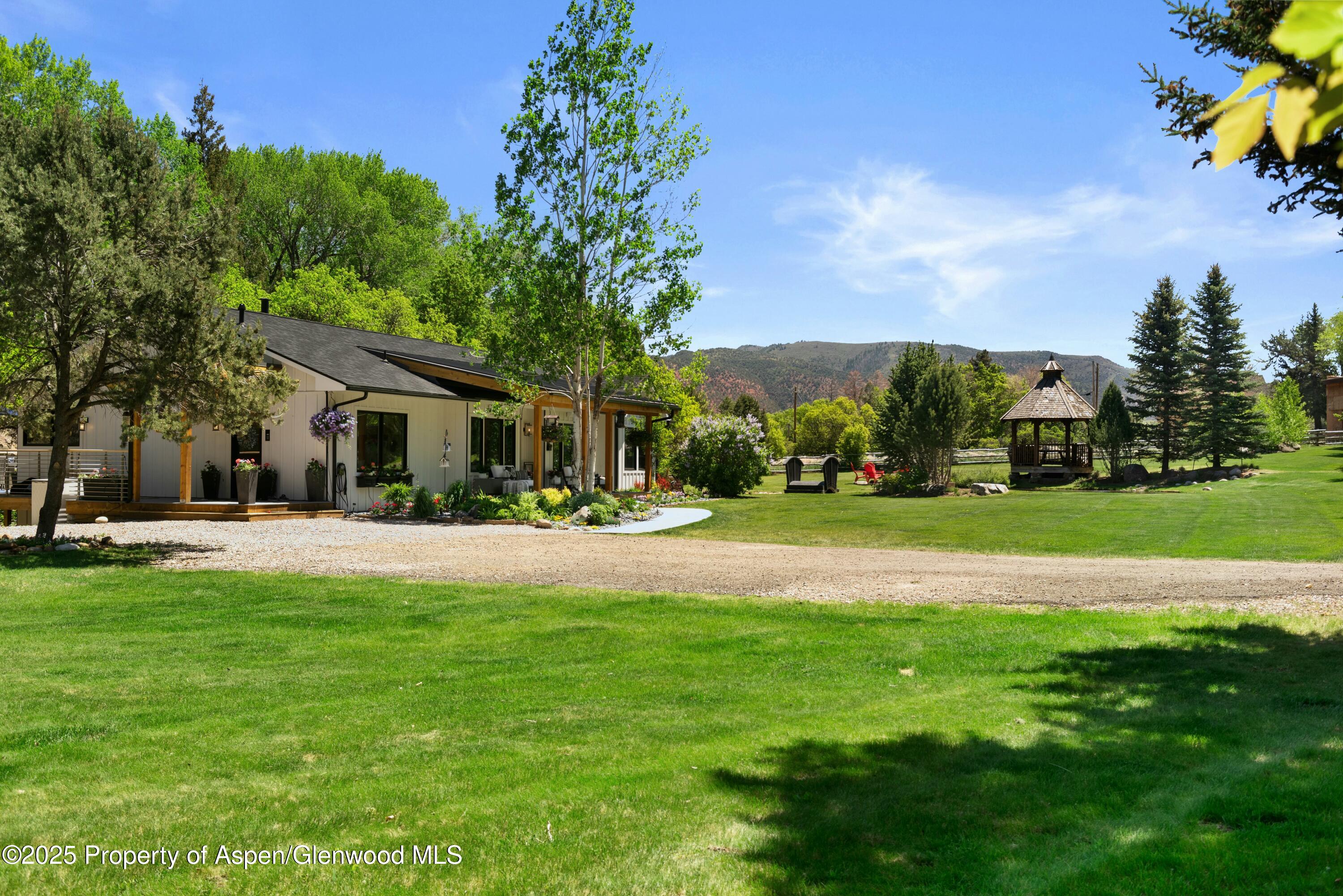 1631 Emma Spur Basalt, CO 81621 - Photo 8 of 52 a front view of house with yard and green space