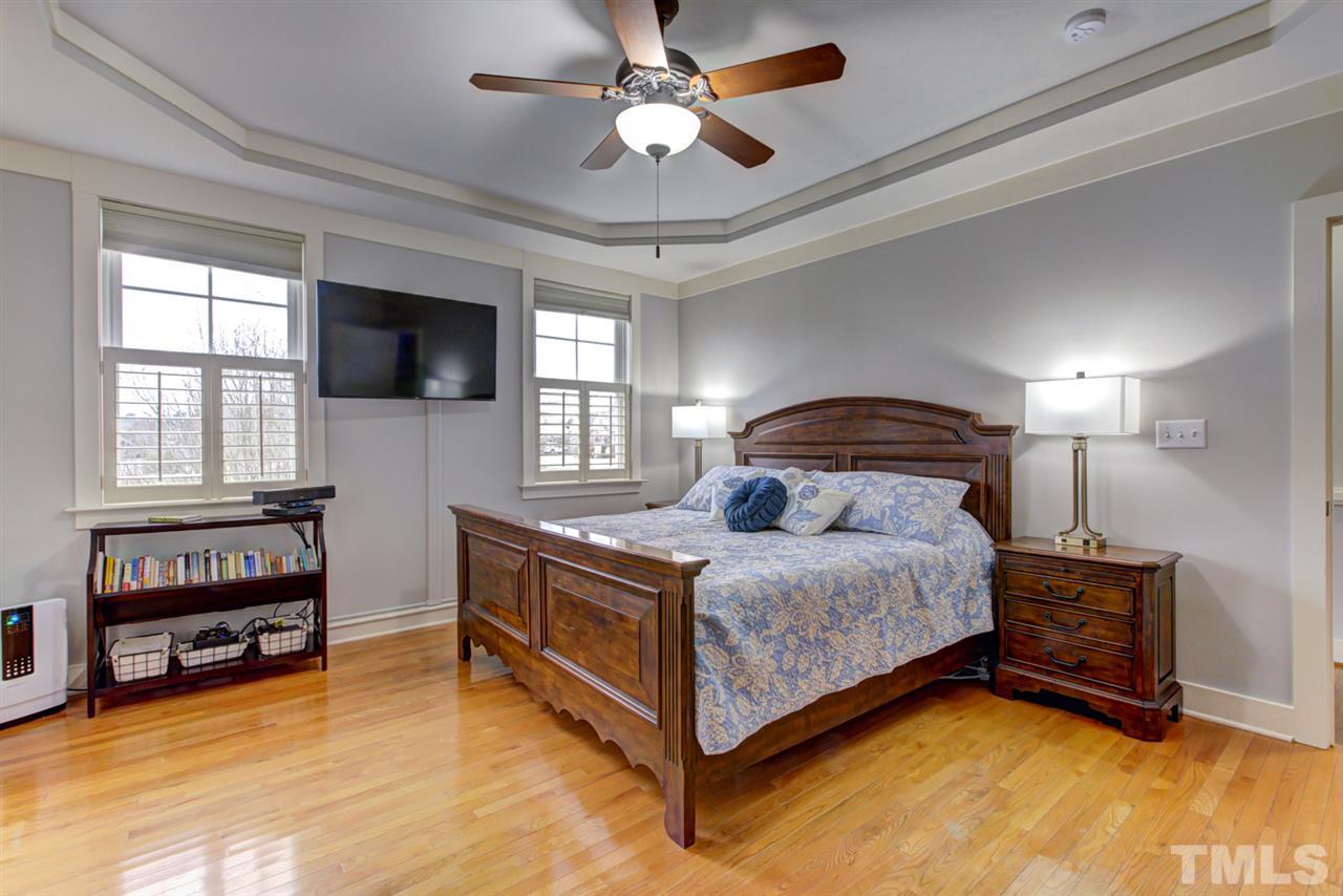 4609 Swordfish Drive Raleigh, NC 27603 - Photo 12 of 30 a bedroom with a bed and a tv