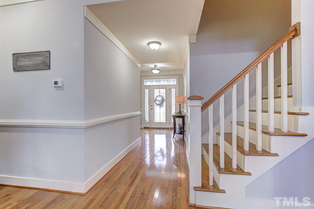 4609 Swordfish Drive Raleigh, NC 27603 - Photo 4 of 30 a view of entryway with wooden floor and stairs