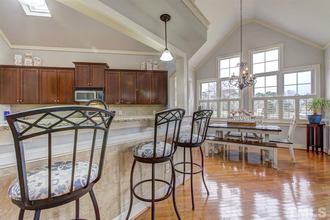 4609 Swordfish Drive Raleigh, NC 27603 - Photo 9 of 30 a view of a dining room with furniture window and wooden floor