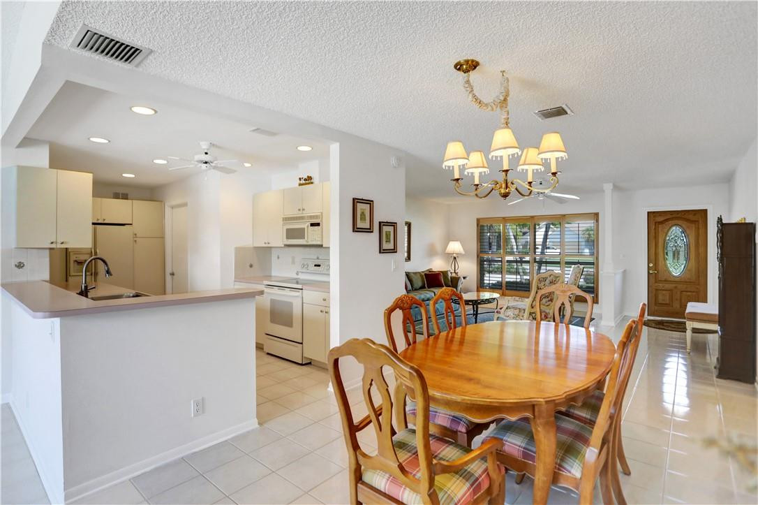 1300 Cormorant Road Delray Beach, FL 33444 - Photo 13 of 68 Dining Room and Kitchen