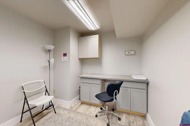 a bathroom with a sink toilet and mirror