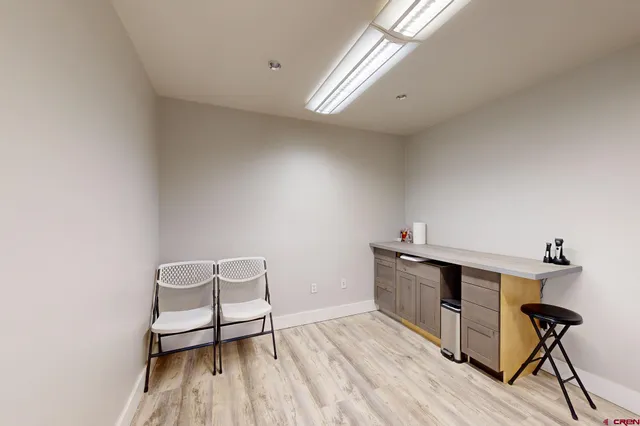 a kitchen with stainless steel appliances kitchen island granite countertop a sink and cabinets