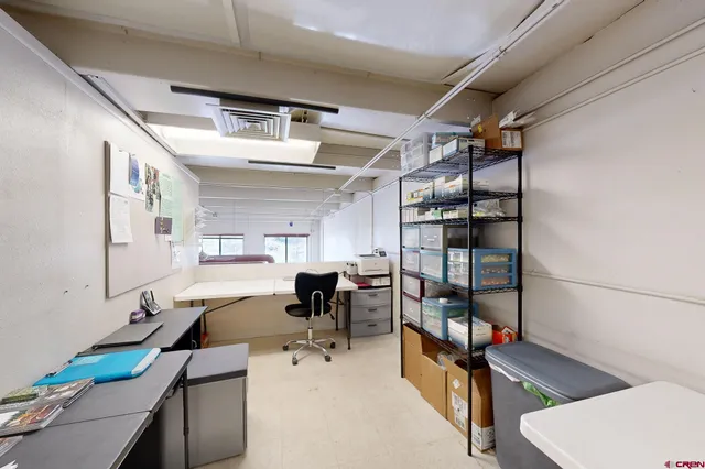 a view of a kitchen with furniture and a window