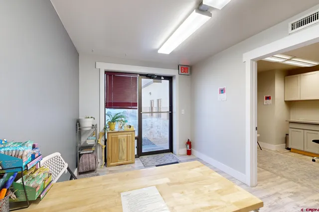 a reading room with furniture and wooden floor