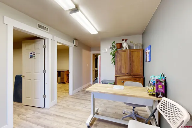 a view of a bedroom with baby crib
