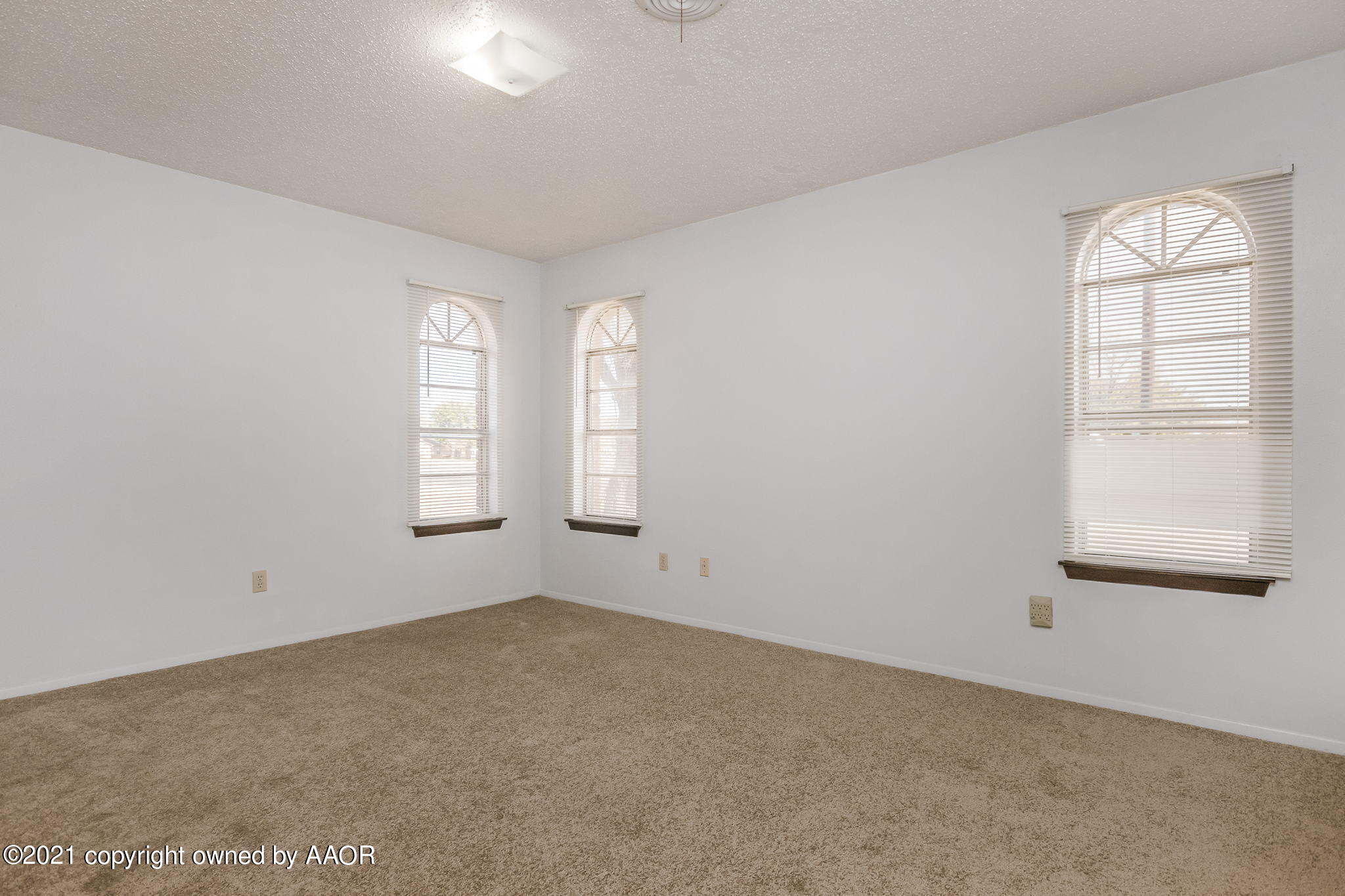 4914 South Georgia Street Amarillo, TX 79110 - Photo 12 of 19 an empty room with windows