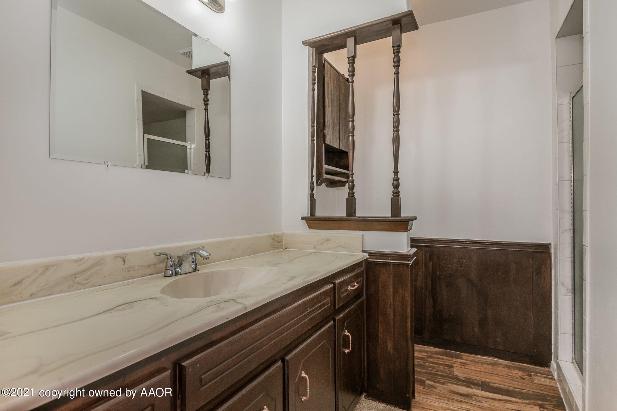 4914 South Georgia Street Amarillo, TX 79110 - Photo 14 of 19 a bathroom with a sink and a mirror