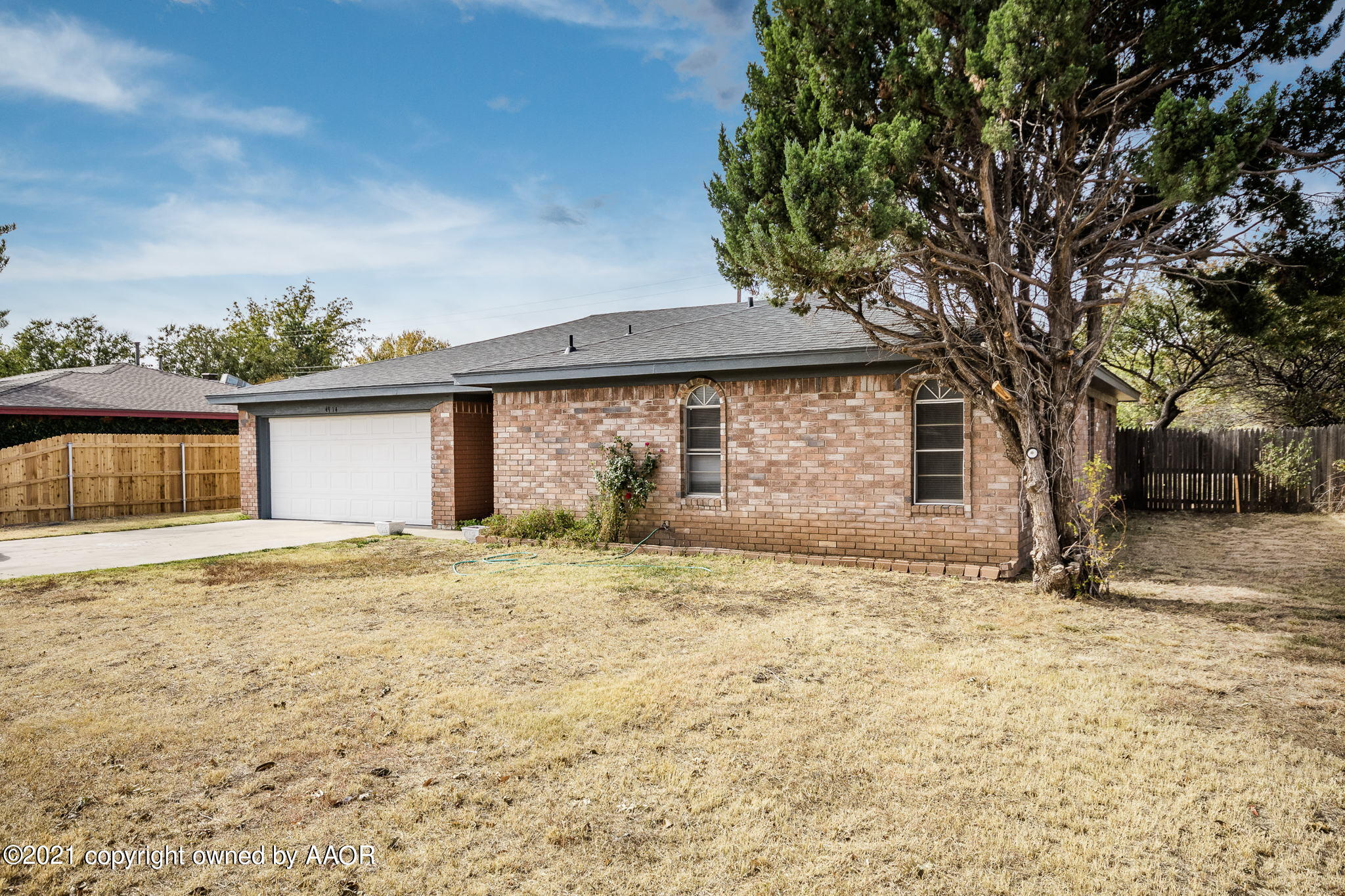 4914 South Georgia Street Amarillo, TX 79110 - Photo 17 of 19 a house with trees in the background