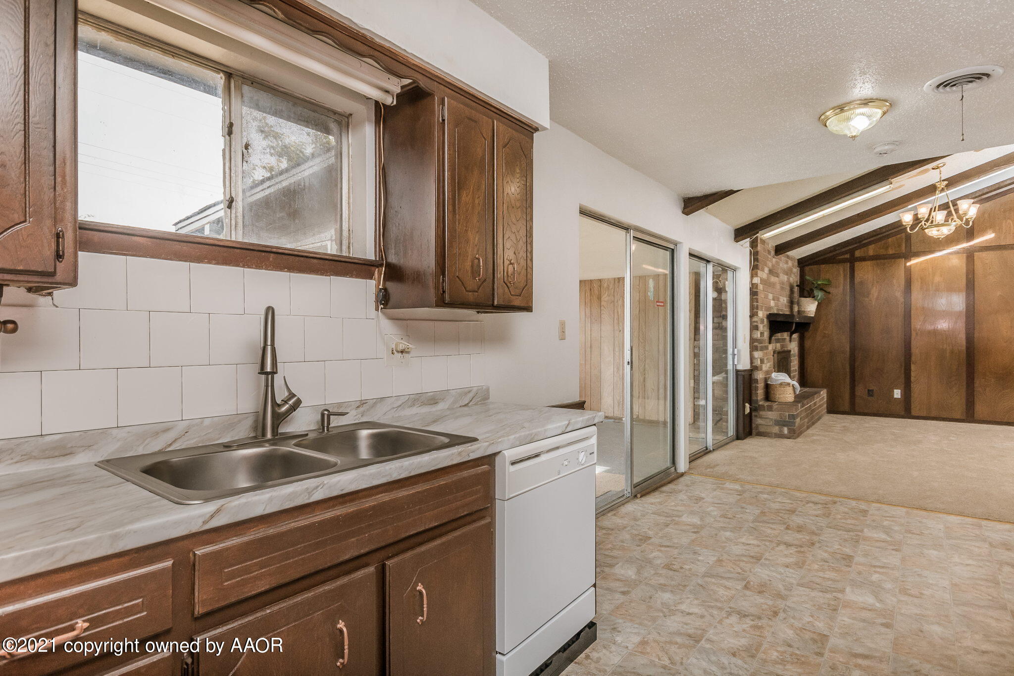 4914 South Georgia Street Amarillo, TX 79110 - Photo 2 of 19 a kitchen that has a sink and cabinets