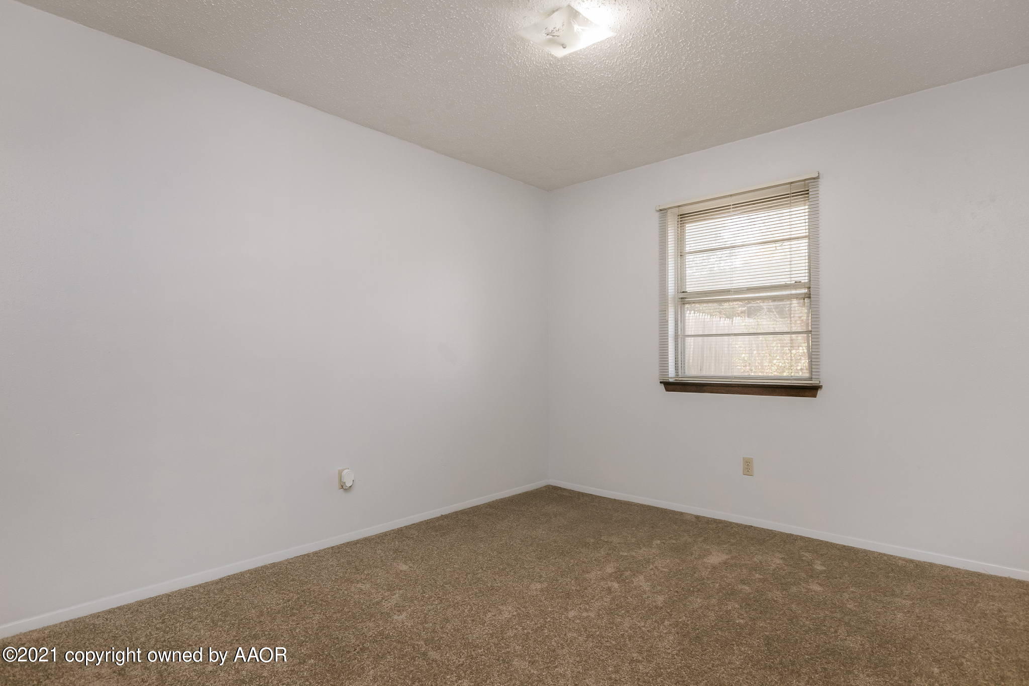 4914 South Georgia Street Amarillo, TX 79110 - Photo 3 of 19 an empty room with a window
