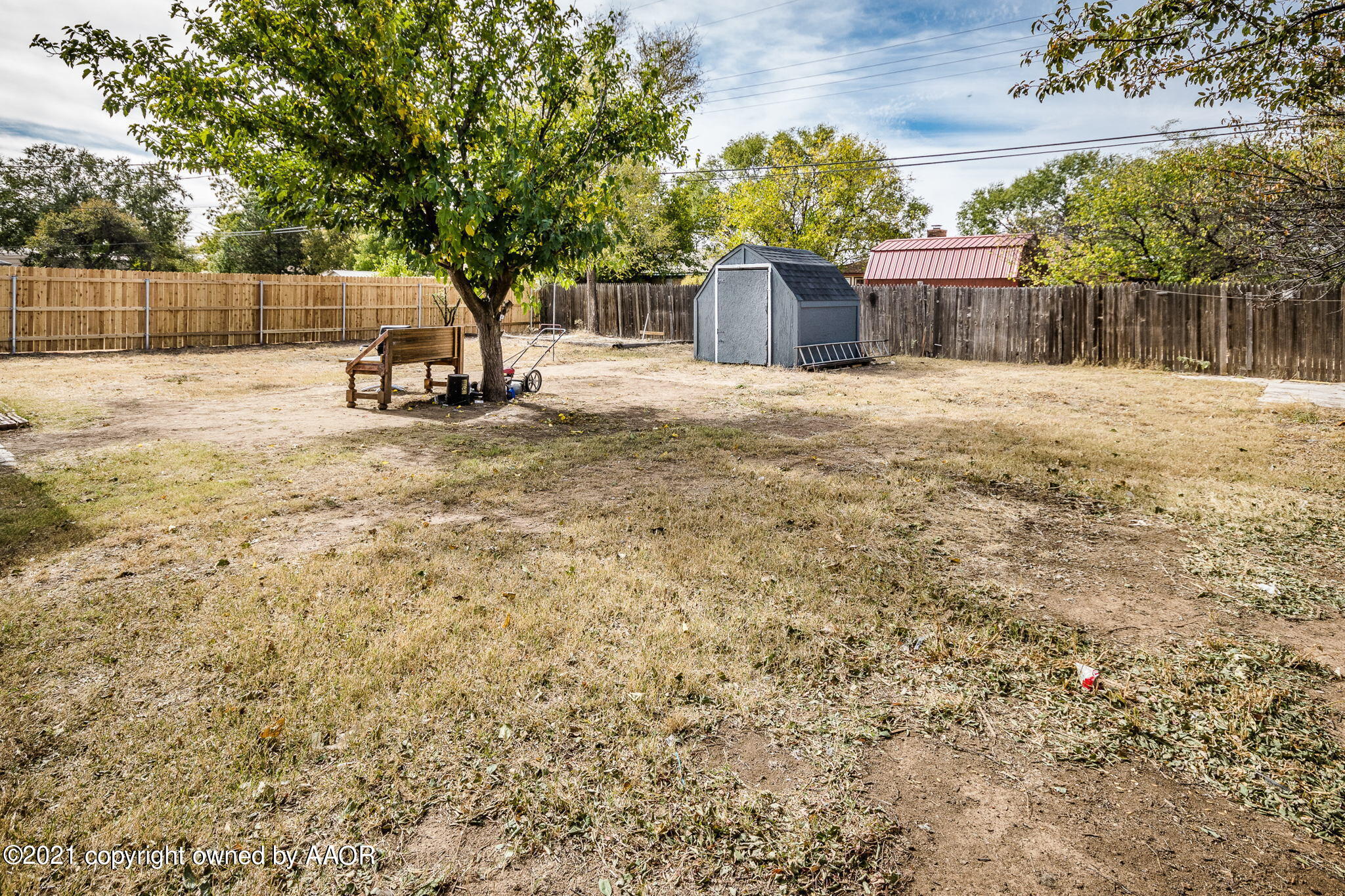 4914 South Georgia Street Amarillo, TX 79110 - Photo 5 of 19 a view of a house with backyard and a tree