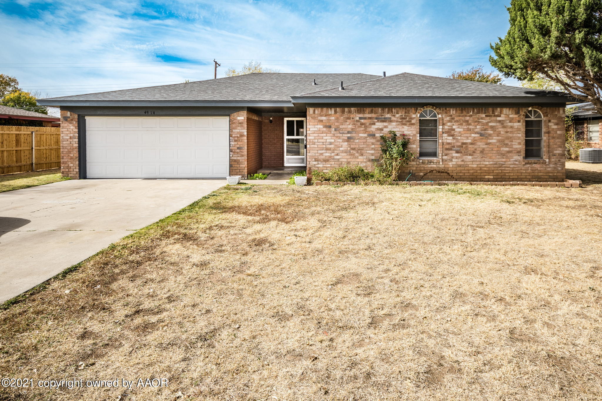 4914 South Georgia Street Amarillo, TX 79110 - Photo 7 of 19 a front view of a house with a yard
