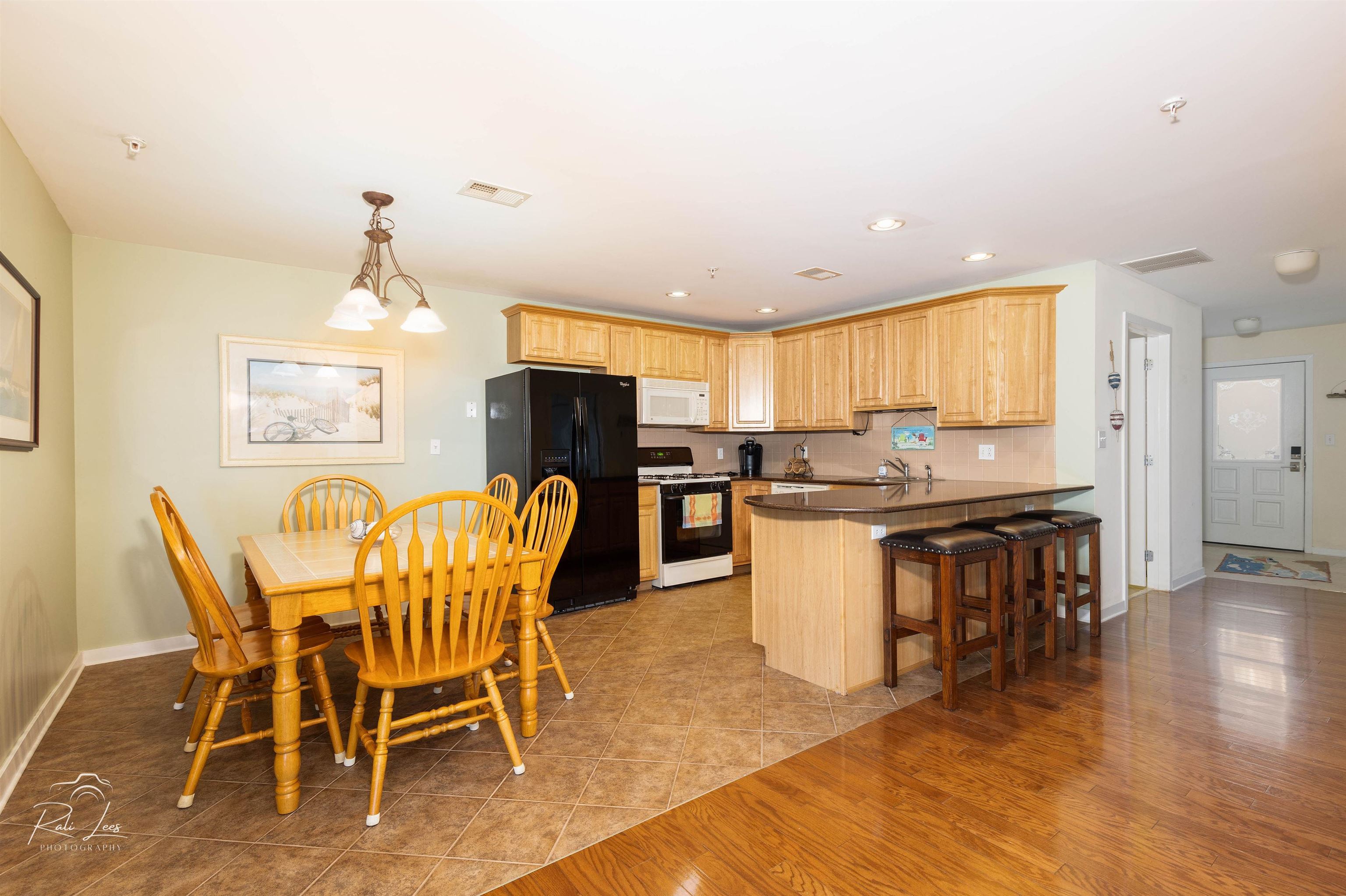 503 East Stanton Road, Unit 403 Wildwood Crest, NJ 08260 - Photo 12 of 42 a view of a dining room with furniture and wooden floor