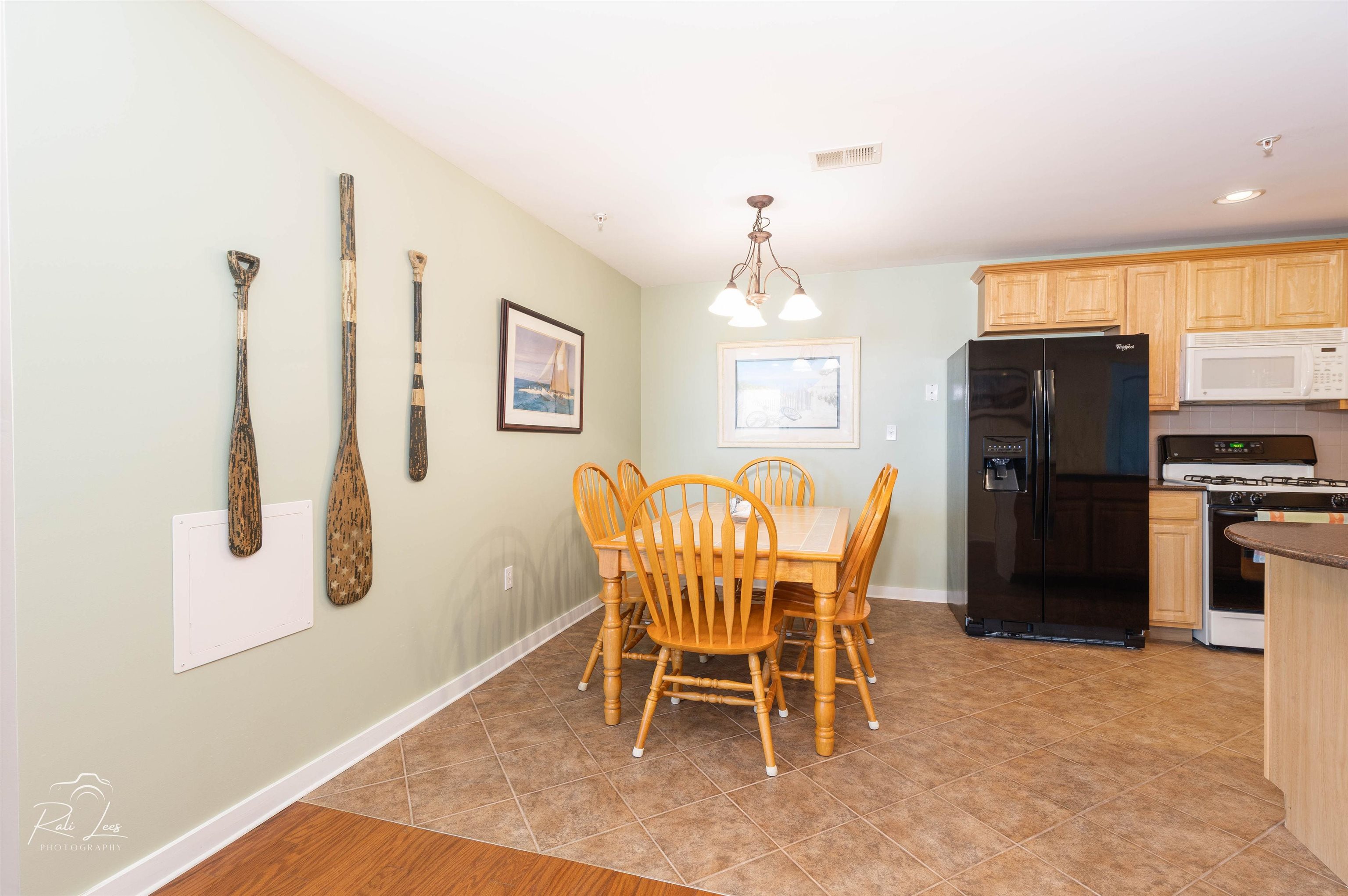 503 East Stanton Road, Unit 403 Wildwood Crest, NJ 08260 - Photo 16 of 42 a dining room with furniture and window