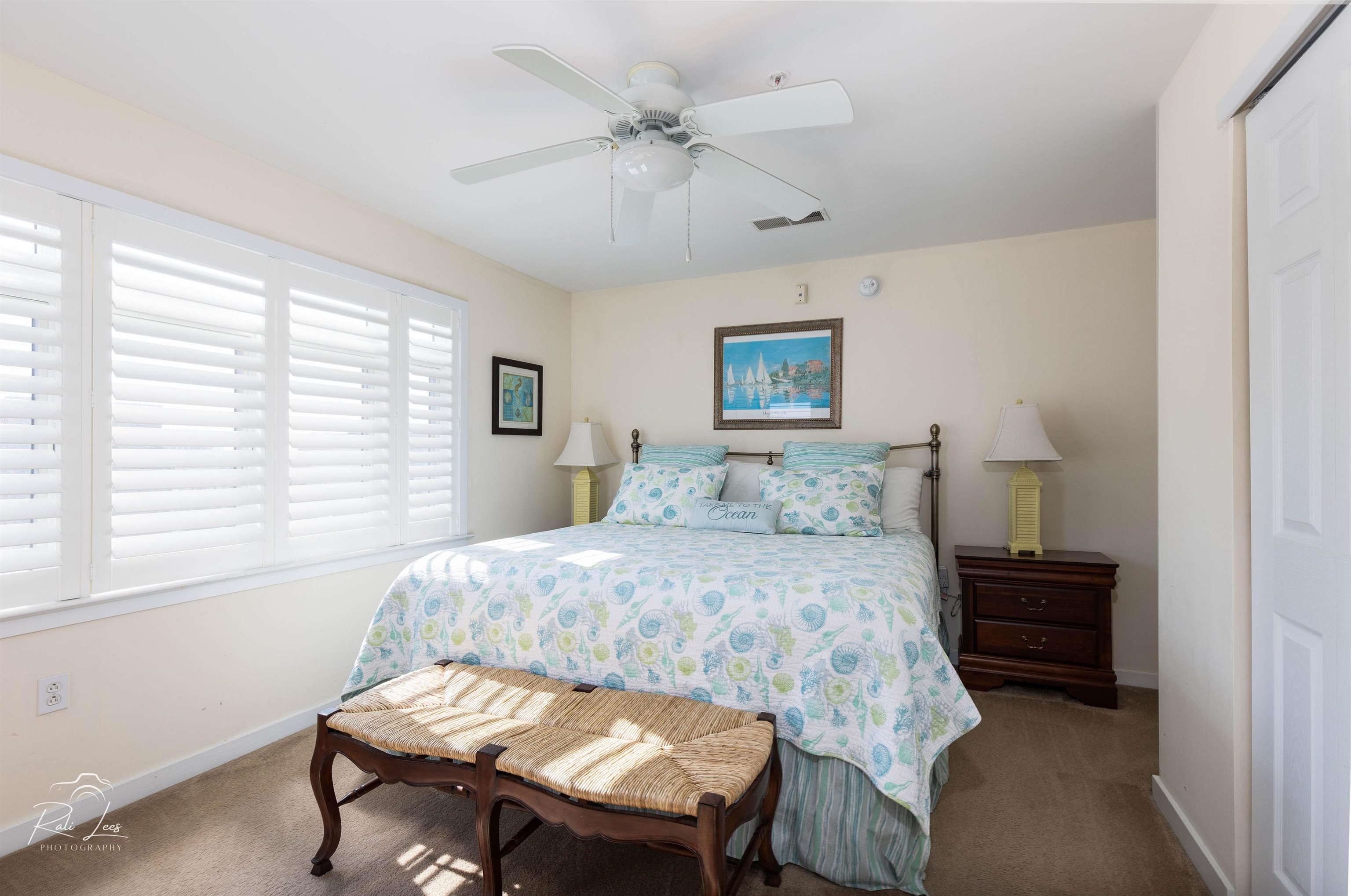 503 East Stanton Road, Unit 403 Wildwood Crest, NJ 08260 - Photo 17 of 42 a bedroom with a bed and a table in it
