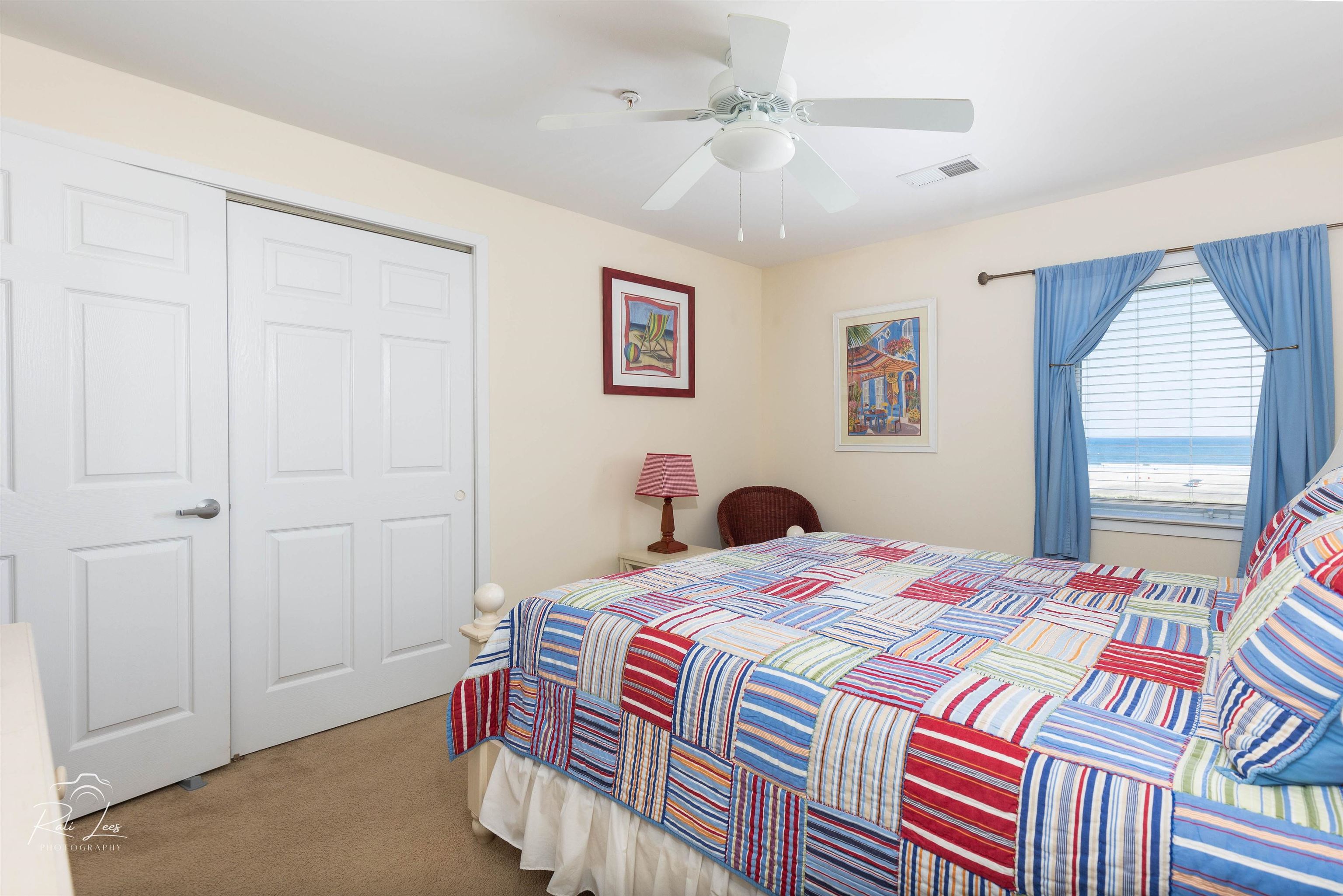 503 East Stanton Road, Unit 403 Wildwood Crest, NJ 08260 - Photo 25 of 42 a bedroom with a bed and a chandelier