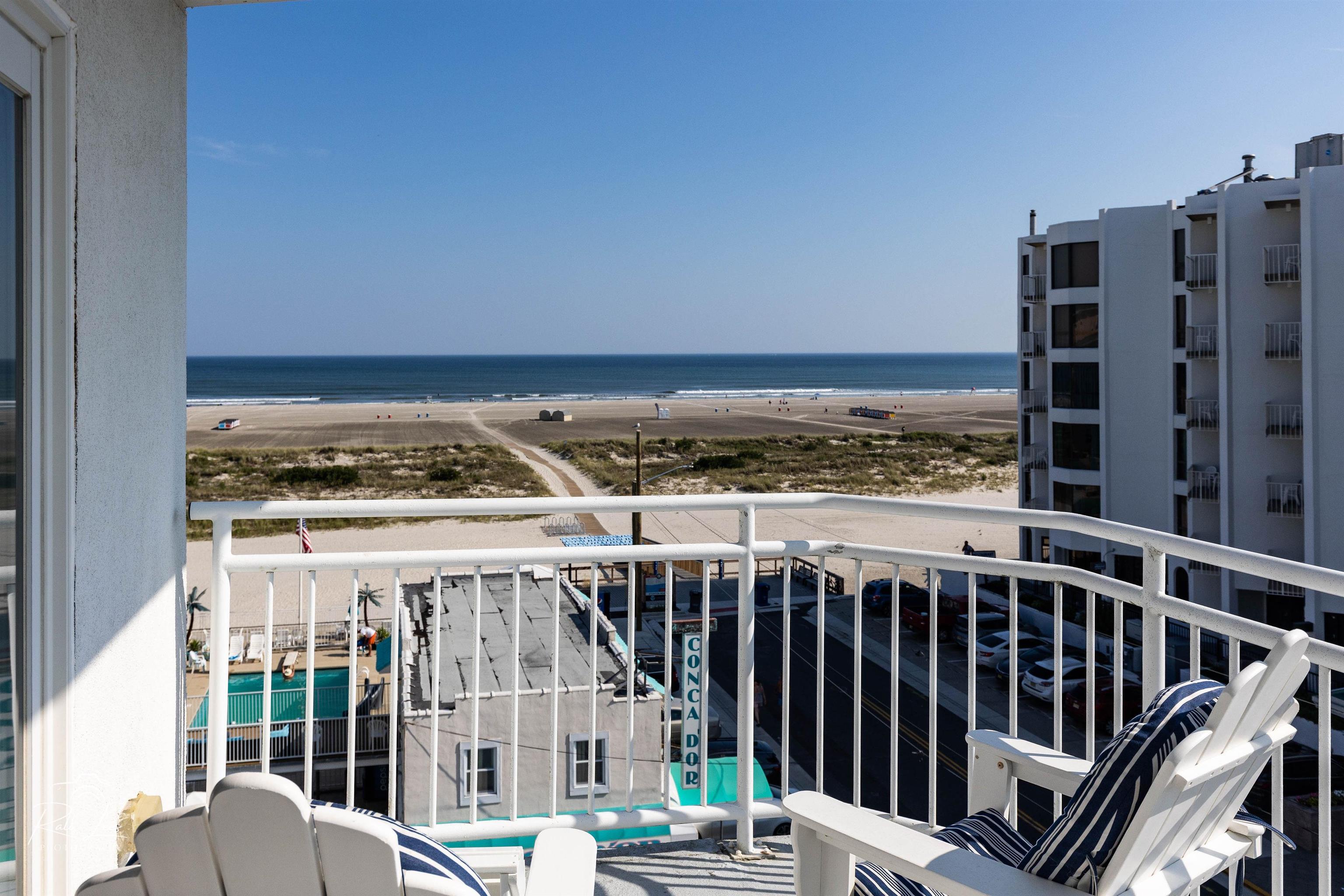 503 East Stanton Road, Unit 403 Wildwood Crest, NJ 08260 - Photo 3 of 42 a view of roof deck with two chairs and wooden floor