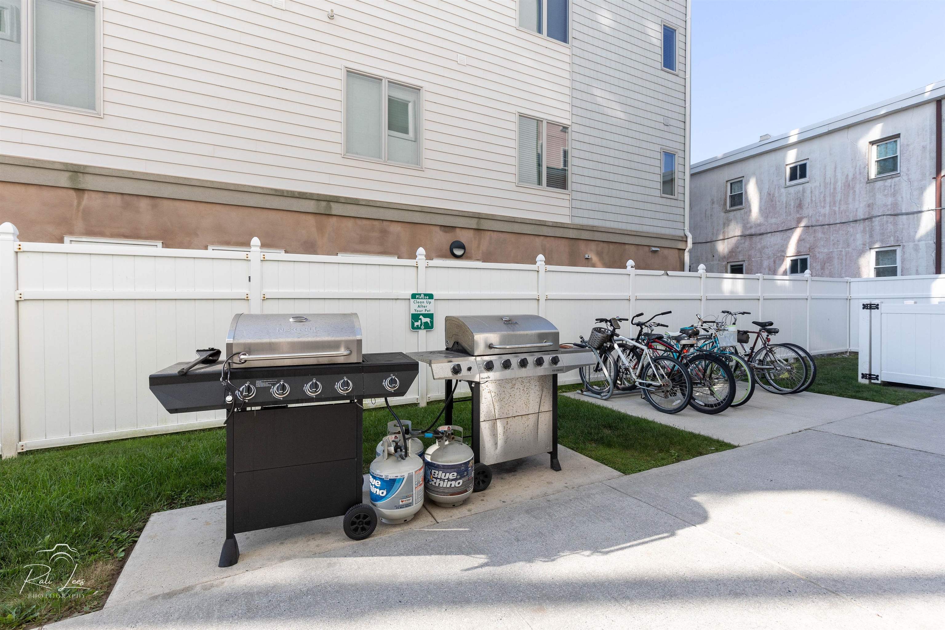 503 East Stanton Road, Unit 403 Wildwood Crest, NJ 08260 - Photo 31 of 42 a view of a chairs and table in the back yard of the house