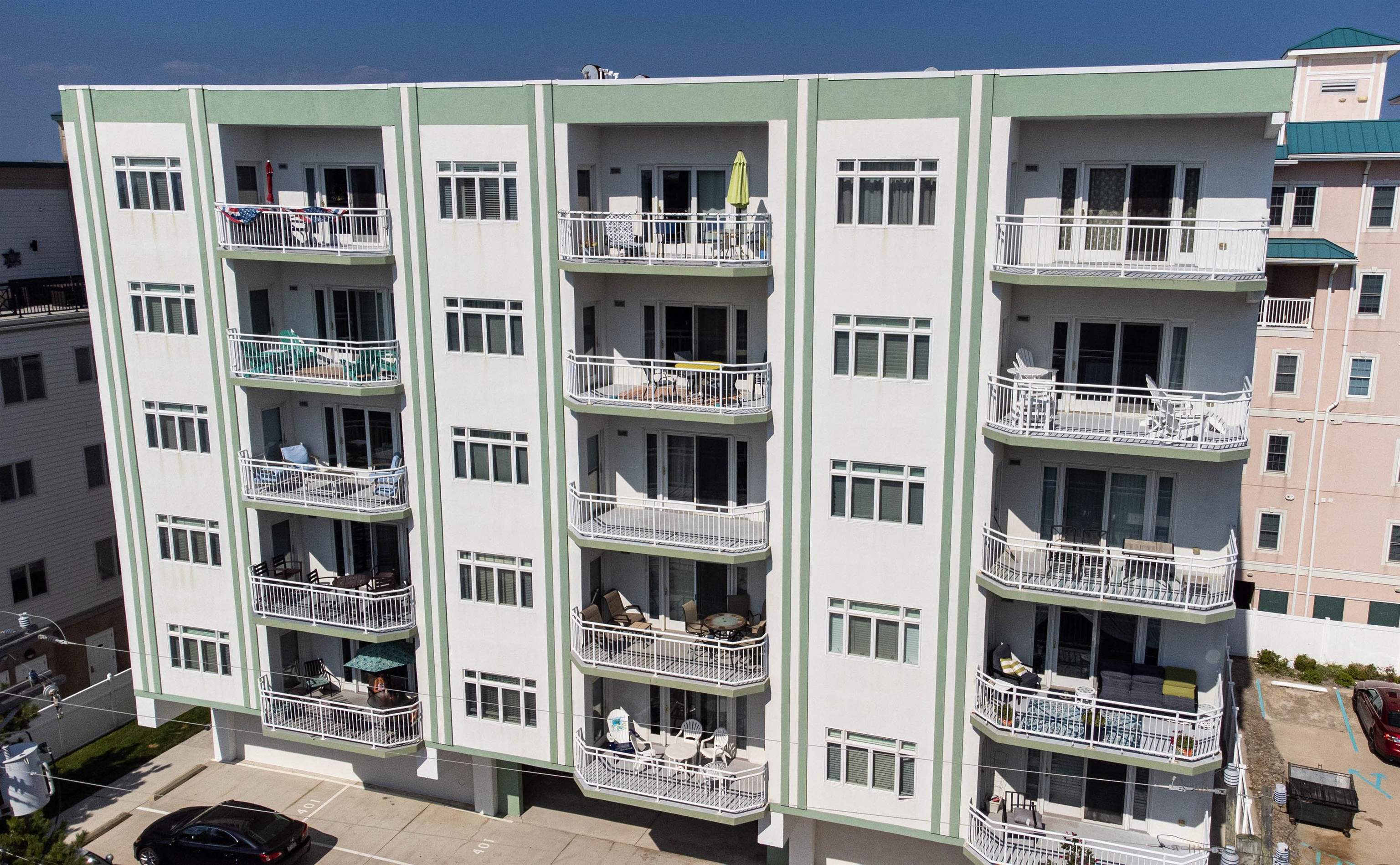 503 East Stanton Road, Unit 403 Wildwood Crest, NJ 08260 - Photo 34 of 42 a front view of a building with glass windows