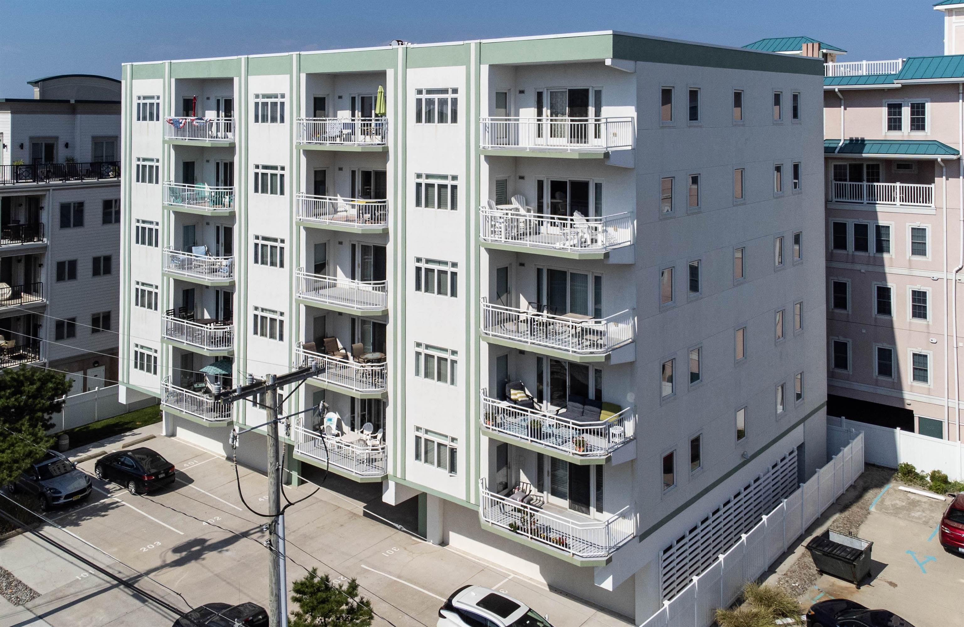 503 East Stanton Road, Unit 403 Wildwood Crest, NJ 08260 - Photo 37 of 42 a view of tall buildings with many windows