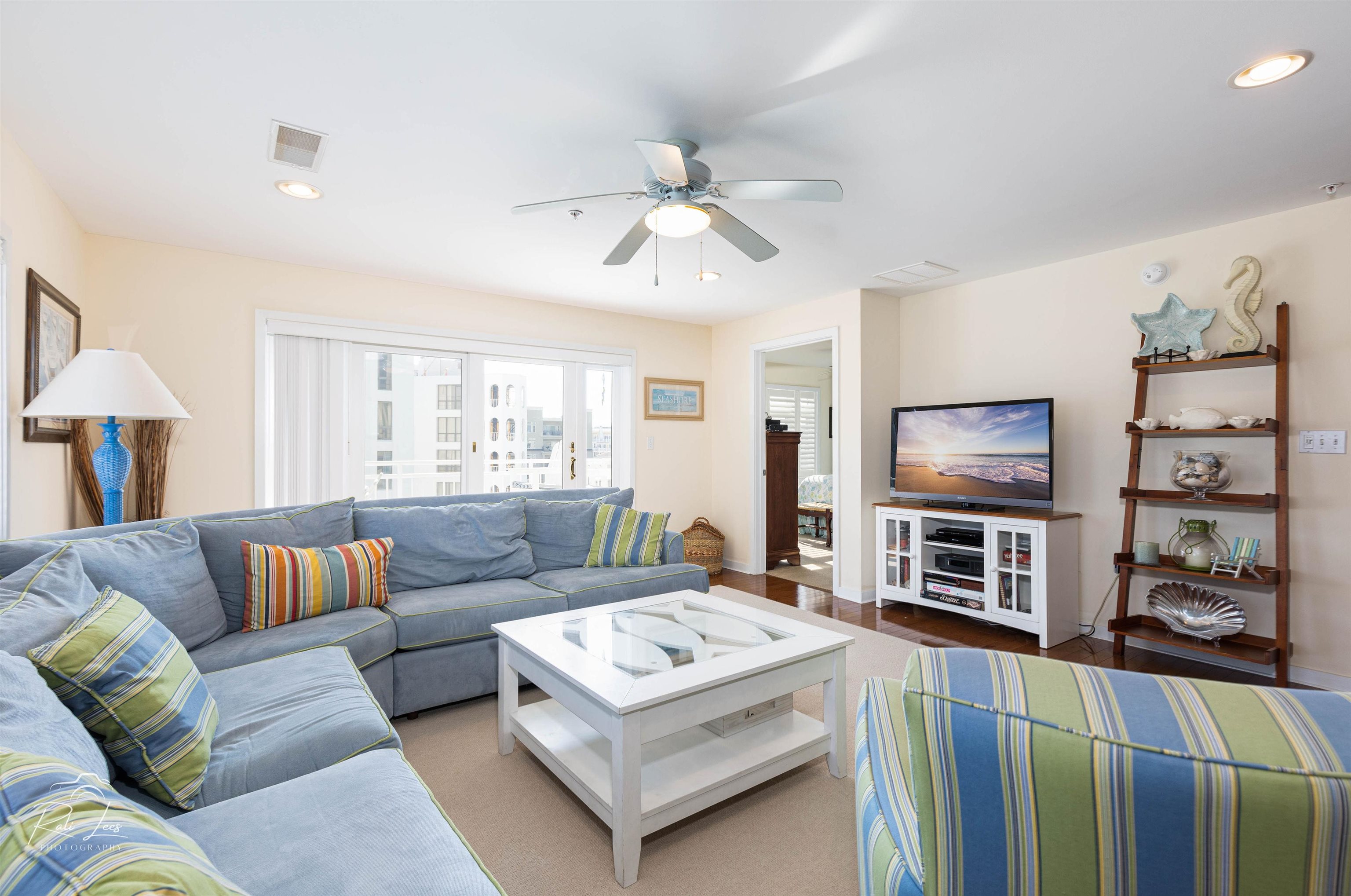 503 East Stanton Road, Unit 403 Wildwood Crest, NJ 08260 - Photo 7 of 42 a living room with furniture and a flat screen tv