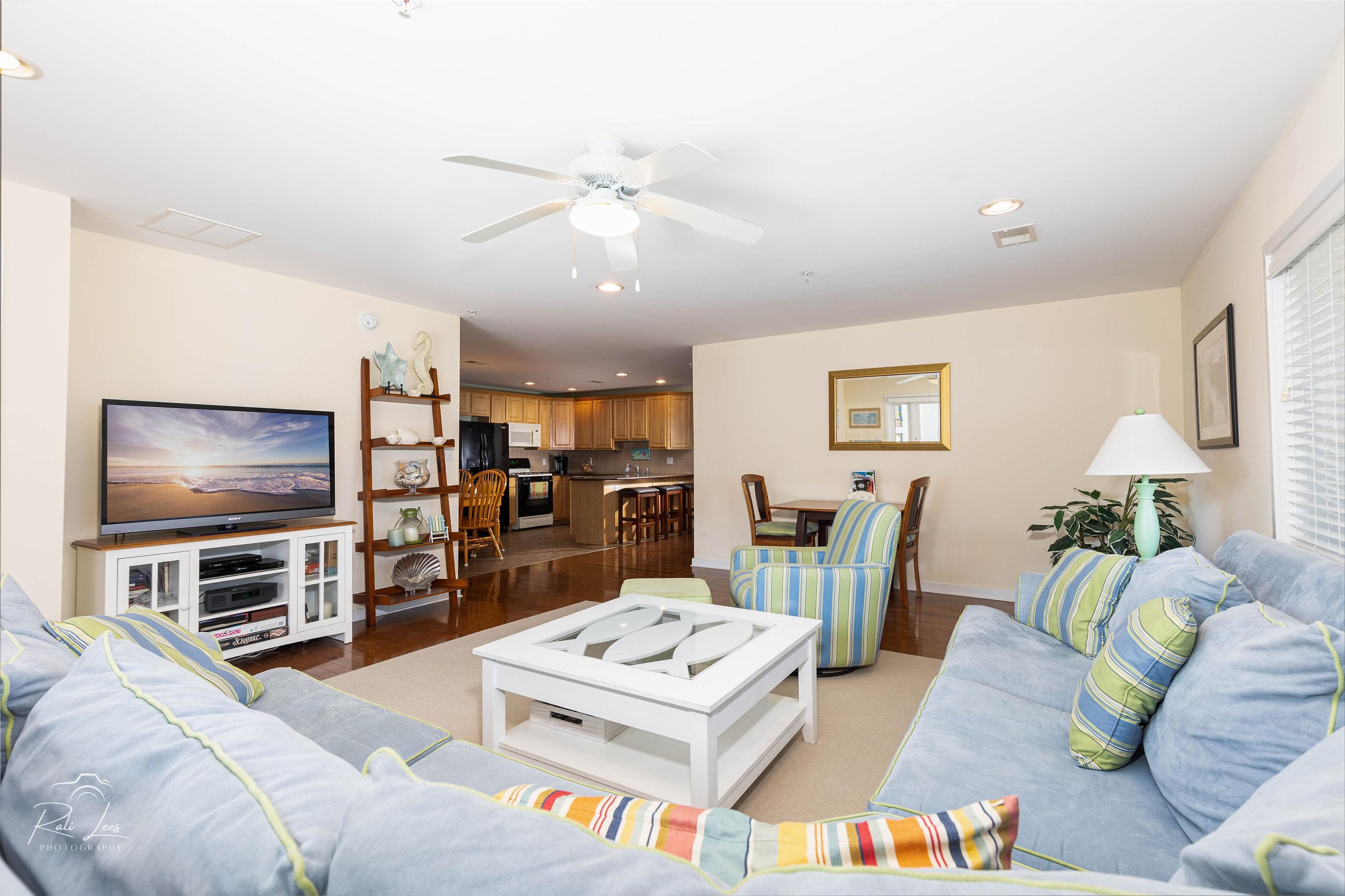 503 East Stanton Road, Unit 403 Wildwood Crest, NJ 08260 - Photo 9 of 42 a living room with furniture and a flat screen tv