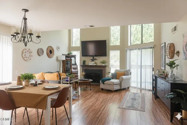 a living room with fireplace furniture and a flat screen tv