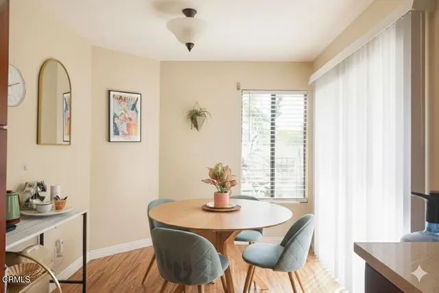 a view of a dining room with furniture window and outside view