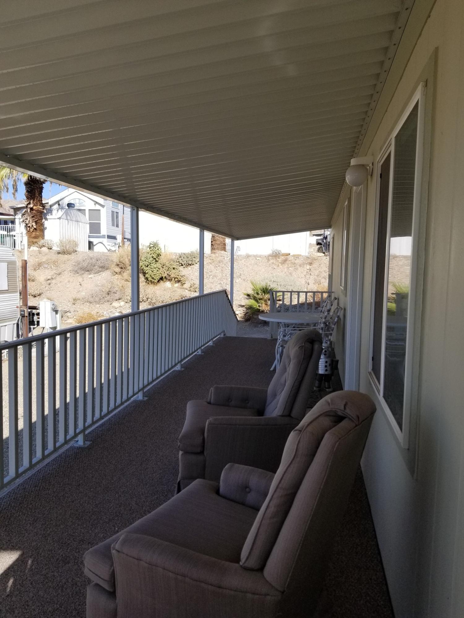 1500 Spa Road Niland, CA 92257 - Photo 5 of 24 a balcony with furniture and a floor to ceiling window