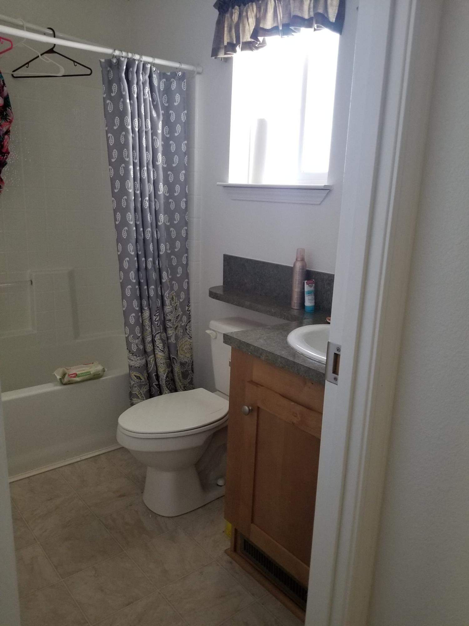 1500 Spa Road Niland, CA 92257 - Photo 10 of 24 a bathroom with a toilet a sink and a window