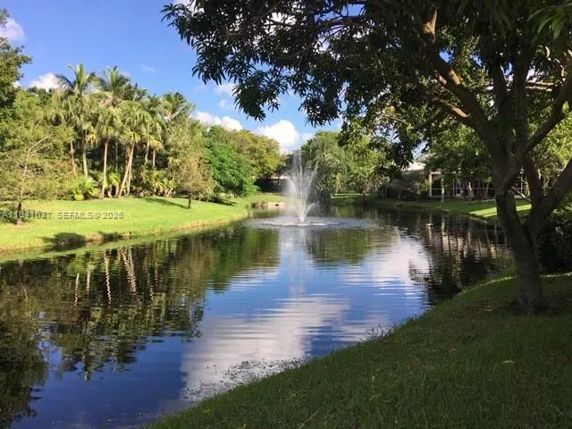 a view of a lake with houses in outdoor space