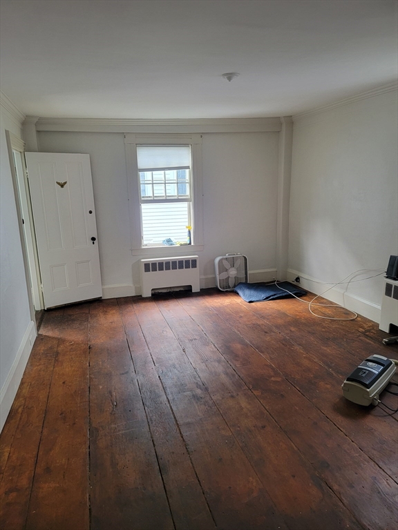 110 Front Street, Unit 3 Marblehead, MA 01945 - Photo 1 of 1 a view of a livingroom with an empty space and a window
