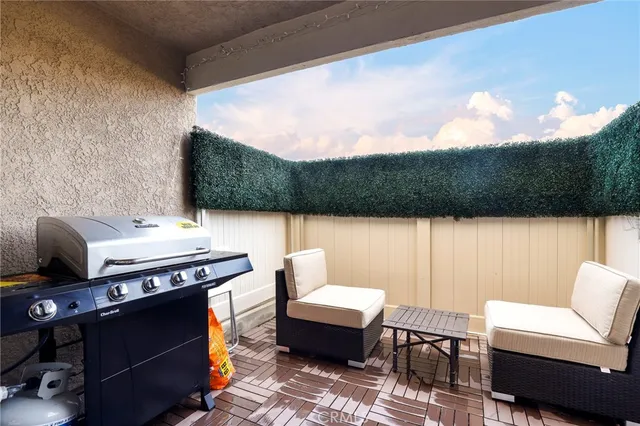 a terrace of a house with outdoor seating