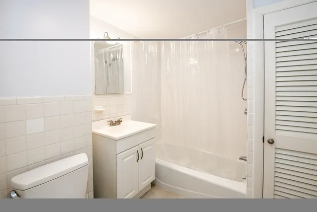 a bathroom with a sink a toilet and a bathtub