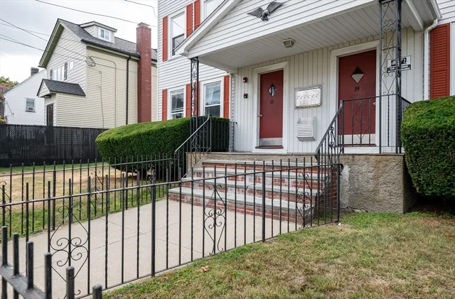 a view of a wrought iron fences in front of house