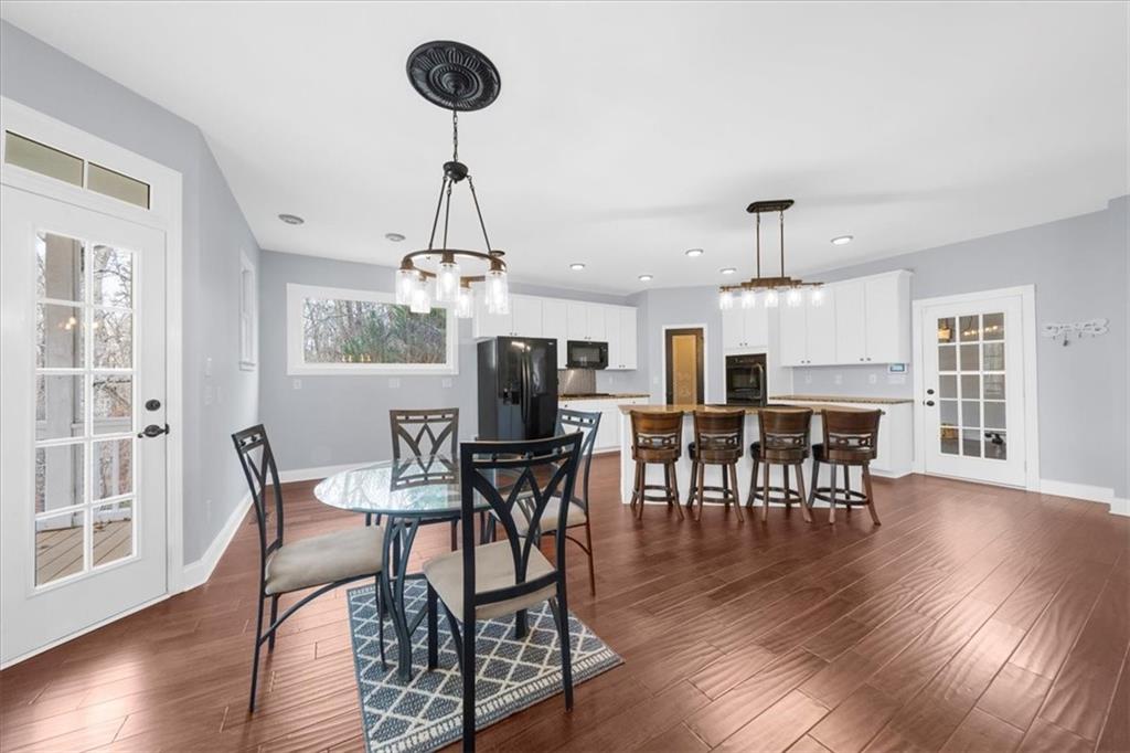 5488 Price Road Gainesville, GA 30506 - Photo 14 of 55 a view of a dining room with furniture window and wooden floor