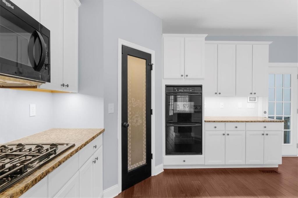 5488 Price Road Gainesville, GA 30506 - Photo 17 of 55 a kitchen with granite countertop a stove and a refrigerator