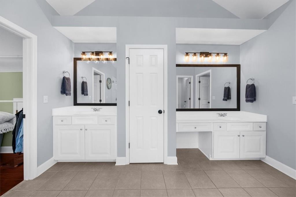 5488 Price Road Gainesville, GA 30506 - Photo 32 of 55 a bathroom with a sink vanity and mirror