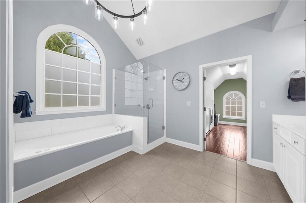 5488 Price Road Gainesville, GA 30506 - Photo 33 of 55 a bathroom with a granite countertop tub sink and mirror