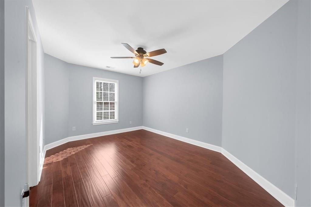 5488 Price Road Gainesville, GA 30506 - Photo 38 of 55 an empty room with wooden floor and windows