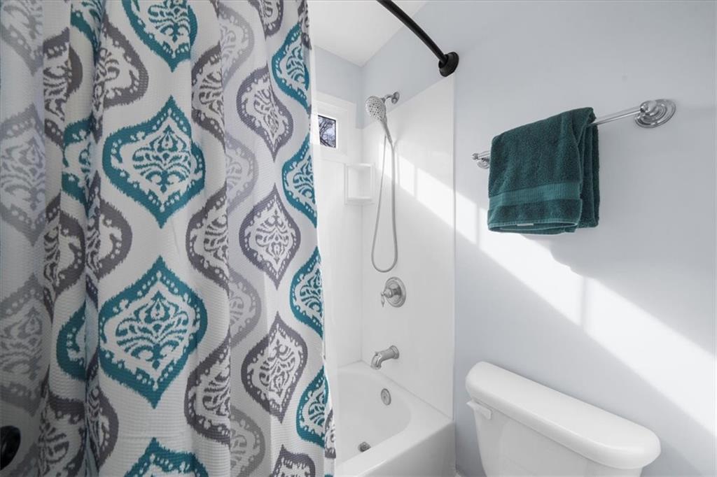 5488 Price Road Gainesville, GA 30506 - Photo 42 of 55 a bathroom with a bathtub and shower