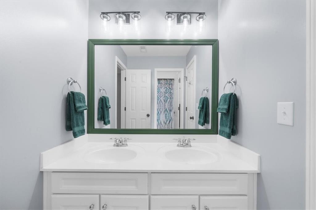 5488 Price Road Gainesville, GA 30506 - Photo 43 of 55 a bathroom with a sink and a mirror