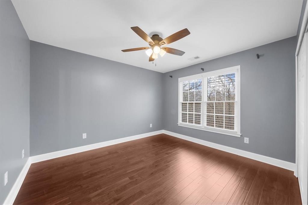 5488 Price Road Gainesville, GA 30506 - Photo 44 of 55 a view of an empty room with wooden floor and a window
