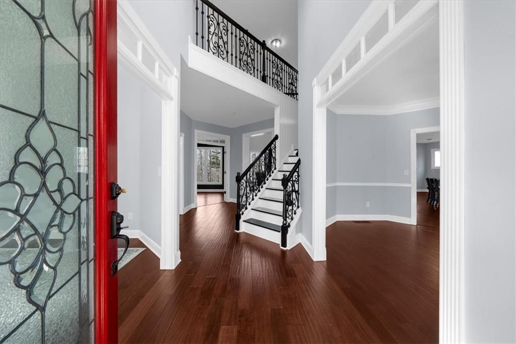 5488 Price Road Gainesville, GA 30506 - Photo 7 of 55 a view of entryway and hall with wooden floor