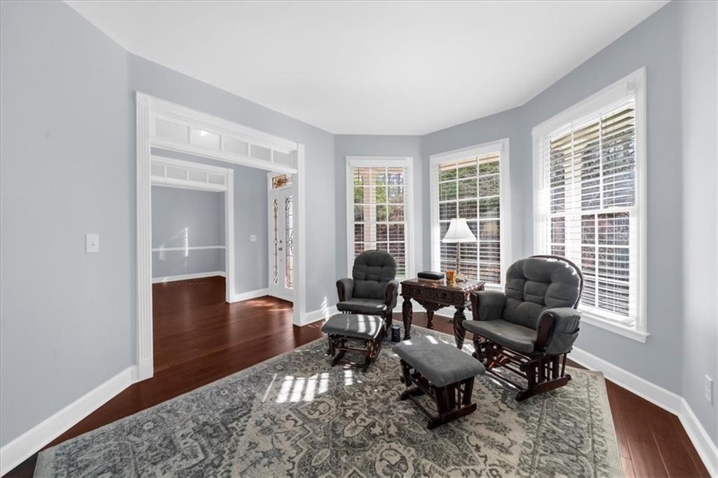 5488 Price Road Gainesville, GA 30506 - Photo 10 of 55 a living room with furniture and floor to ceiling windows