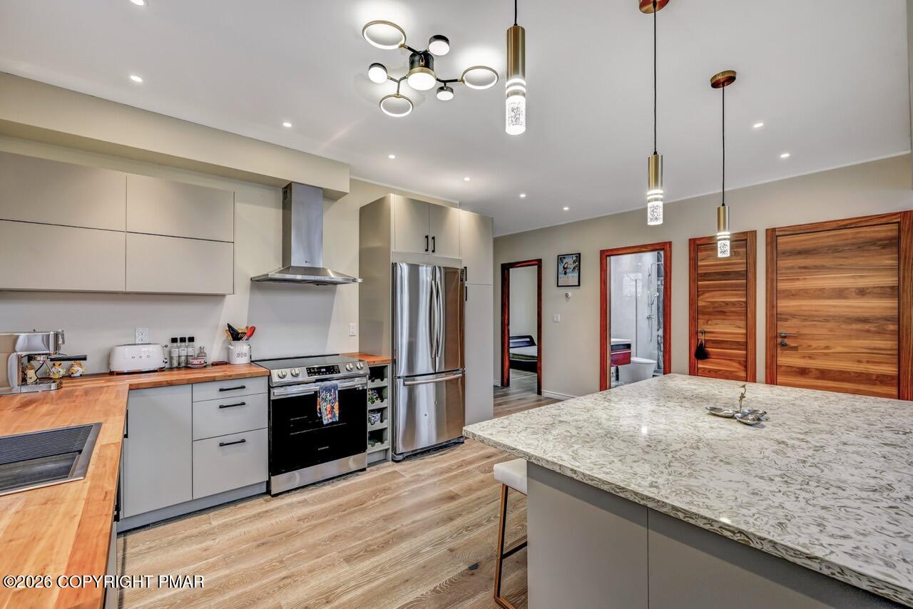 325 Chestnut Road East Stroudsburg, PA 18302 - Photo 16 of 50 a kitchen with stainless steel appliances granite countertop a sink a stove and a refrigerator